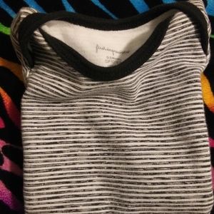 First Impressions baby onesie